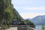 Rv13_060_07242019 - Scooting by a large truck while driving south on the Rv13 during our drive-by along Sørfjorden in July 2019