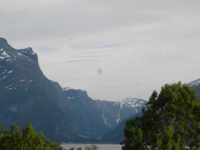 Rv_670_002_jx_07032005 - Near the town of Sunndalsøra, we managed to glimpse this fjord view with some seeimingly very tall waterfalls spilling into the fjord in the distance