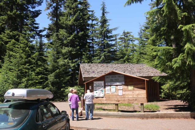 Salt_Creek_Falls_010_07142016 - People gathered around the self-help pay-and-display kiosk to surrender the $5 per vehicle fee to park at the Salt Creek Falls Recreation Area