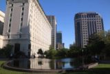 Salt_Lake_City_039_05272017 - Looking back over a fountain towards some high rise buildings whilst standing within Temple Square's east side