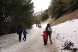 San_Antonio_Falls_16_026_01162016 - The family carefully walking on San Antonio Falls Road when it was covered in snow and ice during our January 2016 visit