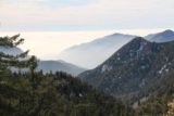 San_Antonio_Falls_16_120_01162016 - Looking downhill towards the LA Basin where it appeared to be having some kind of inversion layer thanks to the straight line of clouds hugging the silhouettes of mountains