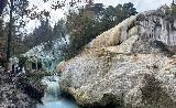 San_Filippo_015_iPhone_11202023 - Pano shot of the commotion at the Bagni San Filippo Hot Springs showing the context of both the Balena Bianca and the green hot springs travertine cascades to its left