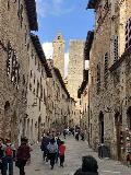 San_Gimignano_004_iPhone_11202023 - Another portrait view of the alleyway looking towards a second tower in the background en route to the center of San Gimignano