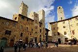 San_Gimignano_025_11202023 - Looking up at a handful of towers at the main square in the center of San Gimignano