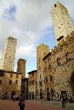 San_Gimignano_058_11202023 - Looking up at a quartet of towers surrounding the secondary square near the center of San Gimignano