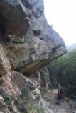 San_Ysidro_Falls_090_04012017 - Context of the fellow hiker going beneath some interesting overhanging rocks or cliffs along the San Ysidro Trail