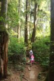 Sandcut_Beach_013_08032017 - Julie and Tahia following some wooden planks on the forested trail to Sandcut Beach