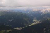 Sass_Pordoi_080_07172018 - Looking down towards the full context of Canazei and the surrounding Dolomite Mountains from the plateau atop Sass Pordoi, Italy