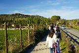 Saturnia_082_11182023 - Julie and Tahia approaching the entrance for the Parcheggio di Cascate del Mulino