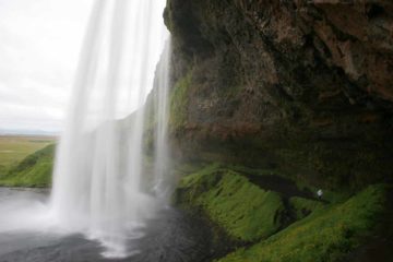 Seljalandsfoss was a conspicuous waterfall that we immediately noticed while driving along the Ring Road.  It was for this reason that we weren't surprised to see it also very popular with tour...