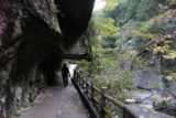 Senga_Falls_082_10172016 - Mom going beneath some overhanging rocks as part of the trail through the Shosenkyo Gorge