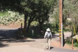 Seven_Falls_014_02152015 - Julie walking past the sanctioned parking area and was now headed towards the water tank and gate at the end of the drivable part of Tunnel Road during our first visit to Seven Falls in 2015