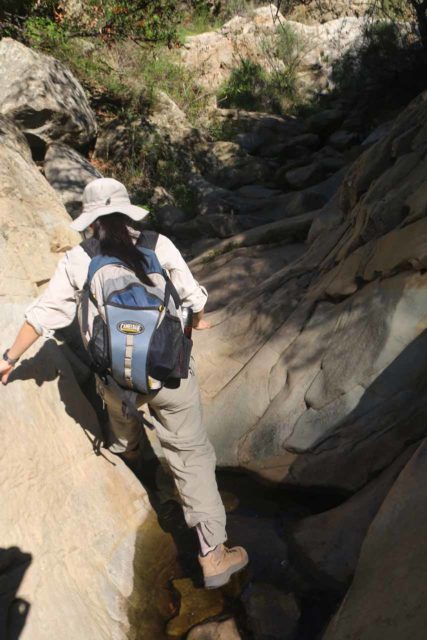 Seven_Falls_053_02152015 - Julie stream scrambling on Mission Creek