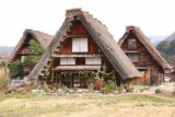 Shirakawa_098_10202016 - Closer look at a trio of thatched-roof buildings and homes in Ogimachi
