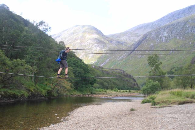 Steall_Falls_134_08282014 - A hiker crossing the three-wire bridge