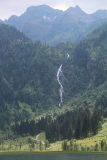 Steirischer_Bodensee_078_07032018 - Focused on the size context of the Steirischer Bodensee Waterfall backed by attractive mountains and towering over the trail leading to its base
