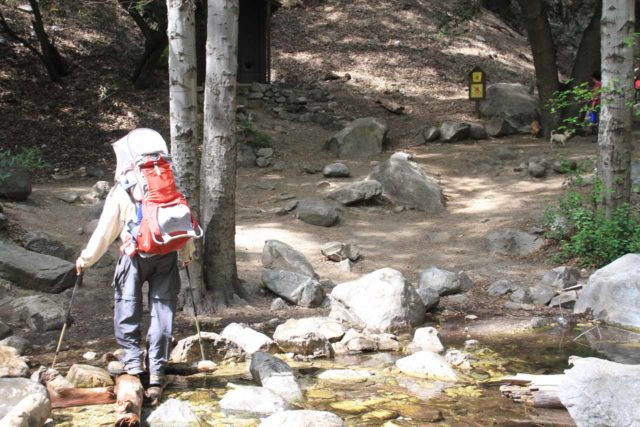 Mom in a pair of canyoneering shoes that were well-suited for water-based adventures like this one in Utah