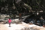 Switzer_Falls_005_04232016 - Crossing over the footbridge to begin the hike to Switzer Falls in April 2016. Tahia was actually hesitant at first to cross this bridge because she thought there was a troll underneath it