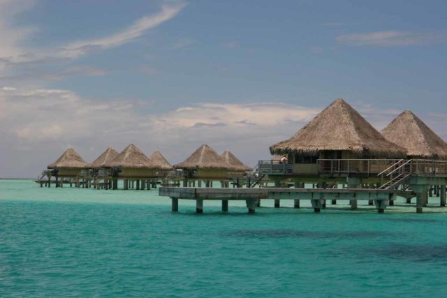 Tahiti_Fam_825_02132007 - Most people visiting Tahiti fly into Papeete, then immediately catch a flight out to Bora Bora or Moorea. Shown here are signature overwater bungalows in Bora Bora