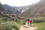Tahquitz_Falls_010_02252017 - The family heading right into Tahquitz Canyon, where you can see the canyon close in up ahead as seen in February 2017