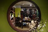 Taipei_190_06272023 - Looking through a circular window towards more furniture on display at Gugong