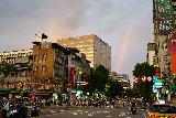 Taipei_422_06282023 - Looking over some busy streets towards an afternoon rainbow in the distance on our way to the Ningxia Night Market