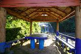 Talofofo_Falls_156_11192022 - Looking through a sheltered picnic area at the Falls 1 of Talofofo Falls