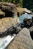 Tarzan_Falls_063_11202022 - Looking over an intermediate waterfall's brink towards the brink of Tarzan Falls