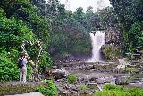 Tegenungan_050_06172022 - Julie looking through an open heart towards the Tegenungan Waterfall