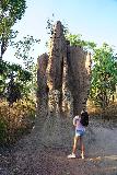 Termite_Mounds_018_06152022 - Tahia dwarfed by one of the tall termite mounds at the Magnetic Termite Mounds