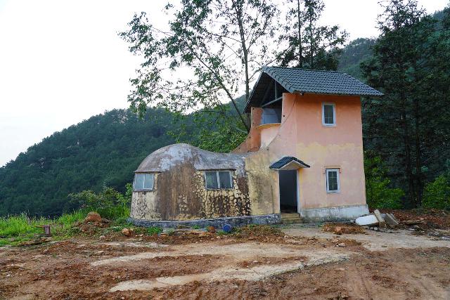 Thac_Ban_Giai_010_04142025 - A curious house that was shaped like a shoe, which was a nursery rhyme callback and one of a handful of features around the Ban Zai or Ban Giai Waterfall to keep you around a little while longer