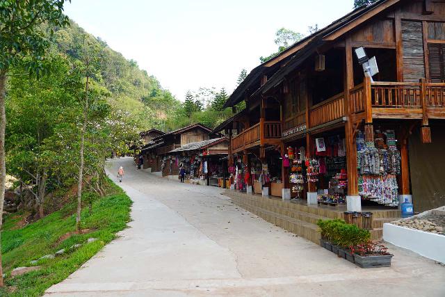 Thac_Dai_Yem_210_04162025 - Looking along a row of shops from local ethnicities selling their wares at the Thac Dai Yem Waterfall Ecotourism Park