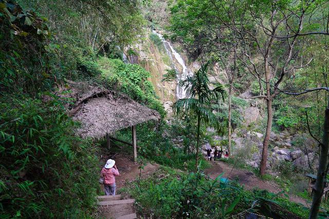 Thac_Go_Lao_019_04162025 - Mom descending steps towards the base of the Thac Go Lao Waterfall