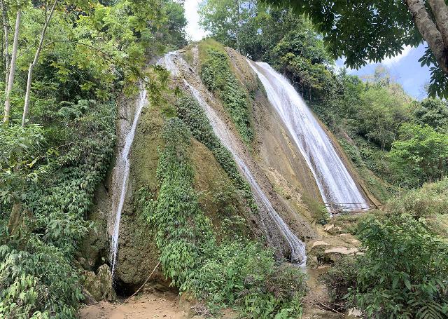 Thac_Tat_Nang_004_iPhone_04172025 - Looking up at disjointed segments of just part of the Thac Tat Nang Waterfall from its base, which made me think this would be a real spectacle if we were here during its Wet Season flow as opposed to our mid-April 2025 Dry Season flow