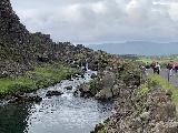 Thingvellir_017_iPhone_08062021 - Context of the Drowning Pool and neighboring cascades with the walkway through the Almannagjá at Þingvellir