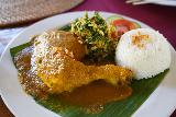 Tirta_Gangga_129_06182022 - Chicken curry and Indonesian sambar with rice dish served up at the restaurant within the marketplace at Tirta Gangga