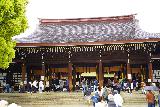 Tokyo_167_04062023 - Closer look at people praying or just checking out the main temple building within the Meiji Jingu Shrine Complex in Tokyo