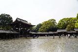 Tokyo_174_04062023 - Broad look back across the wet and wide open courtyard fronting the main temple building in the Meiji Jingu Shrine Complex in Tokyo