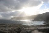 Torndirrup_012_06192006 - Looking towards the late afternoon sun between some storm clouds at Torndirrup National Park