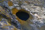 Trollafoss_111_08192021 - Landscape look into a deep pothole looking like an abyss by the Trollafoss Waterfall
