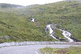 Turtagro-Over_Ardal_mtn_pass_rd_035_07212019 - Cascade tumbling before this bend in the road in Fardalen