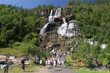 Tvindefossen (I've also seen it spelled Tvinnefossen) was a gorgeous 152m waterfall tumbling in strands with a graceful character that strangely contrasted the gushing waterfalls we had been used...