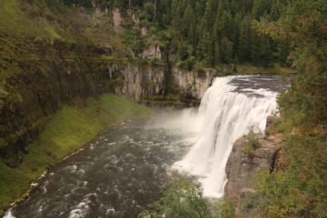 Upper Mesa Falls was a spectacular river waterfall on the Henry's Fork of the Snake River.  Said to be as tall as a 10-story building (114ft) and 200ft wide with a flow rate that would vary between...