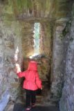 Urquhart_Castle_061_08262014 - Tahia checking out a latrine at Urquhart Castle