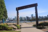 Vancouver_091_07312017 - Looking through the archway near the First Nation's Totem Pole towards the skyline of downtown Vancouver