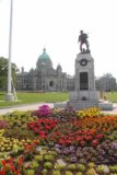 Victoria_BC_023_08022017 - Looking over a different bed of flowers fronting a soldier statue and the Parliament House at the Victoria Harbour