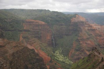 Waipoo Falls (or Waipo'o Falls) is a towering waterfall viewed from a distance as you drive the Waimea Canyon Road (Hwy 550).  There are several places along the road...