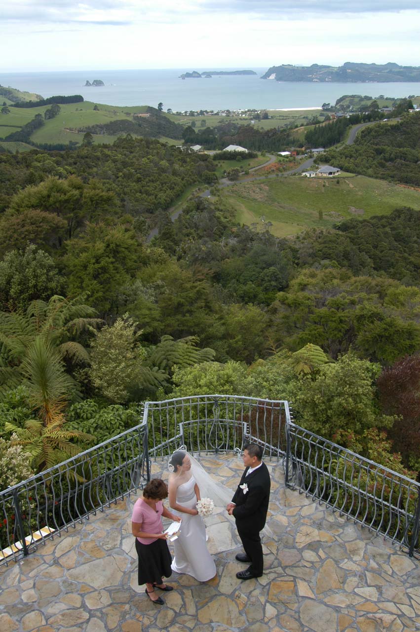 Julie and I exchanging vows on the terrace at Villa Toscana Lodge in Whitianga, New Zealand - one of our most unforgettable stays, especially given the moment