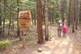 Woodbine_Falls_050_08092017 - Julie and Tahia hiking past the Absaroka-Beartooth Wilderness sign